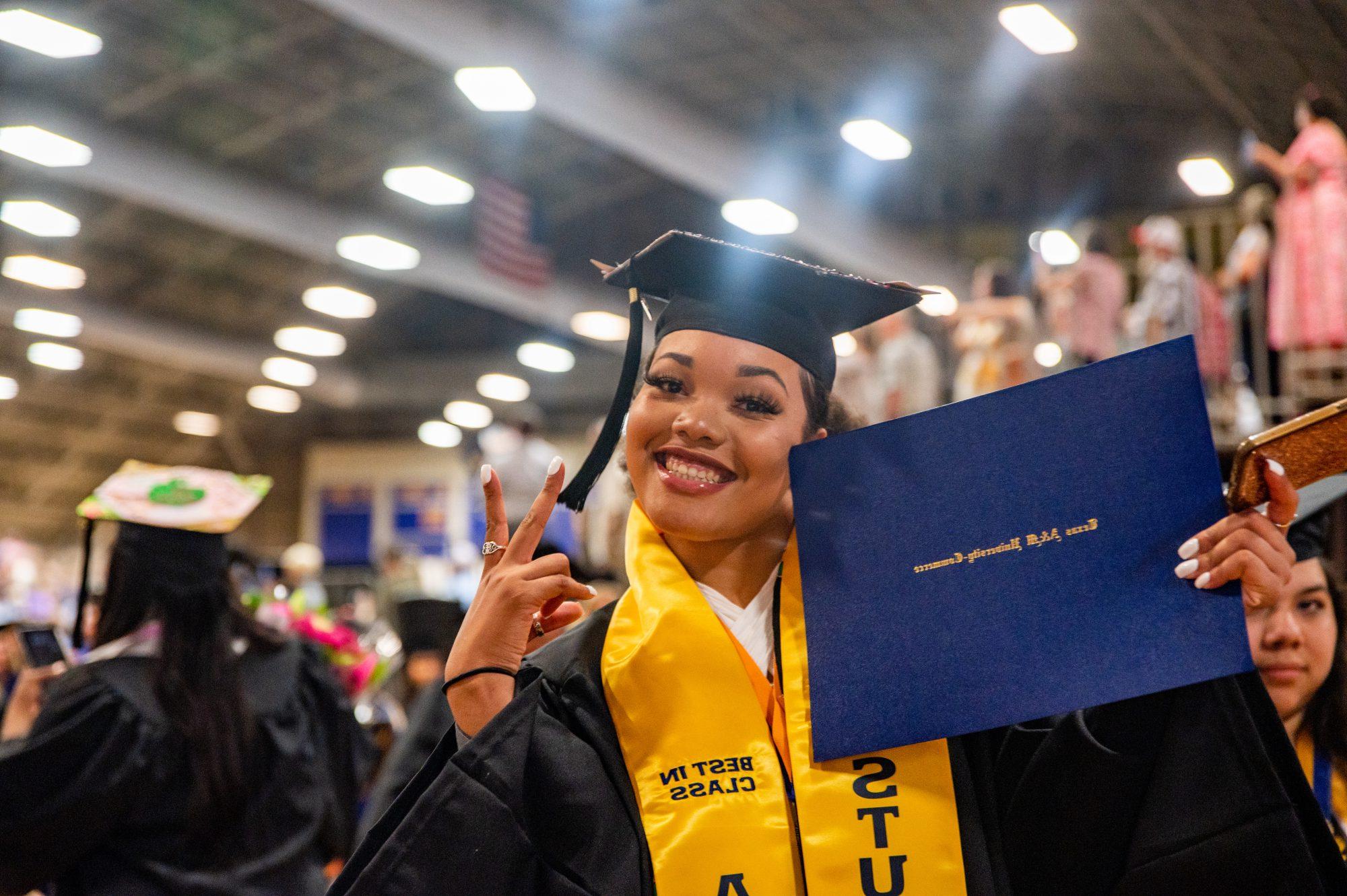 A female student smiling at the camera man.